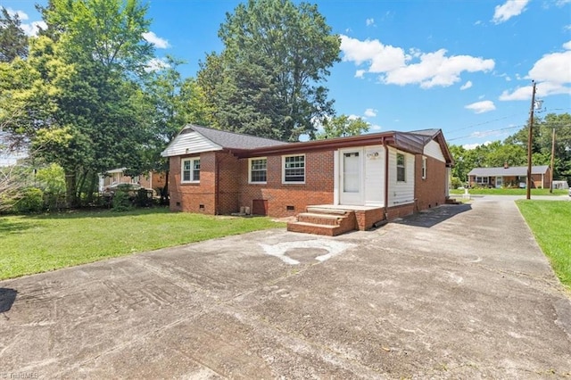 2102 Bothwell St, Greensboro, NC 27401 - single story home with driveway, brick siding, crawl space, and a front lawn