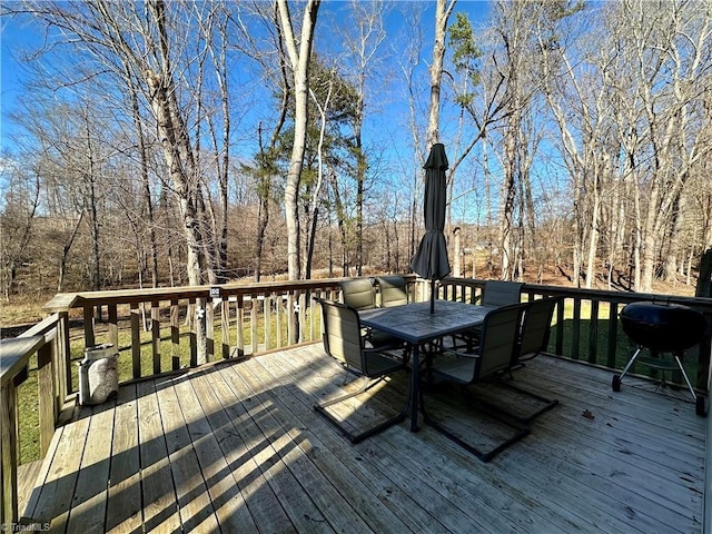 wooden terrace featuring a grill