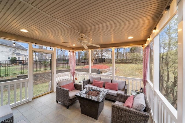 sunroom with a ceiling fan