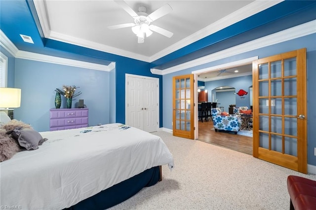 carpeted bedroom featuring french doors, baseboards, and crown molding