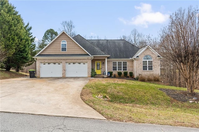 view of front of property featuring a garage and a front yard