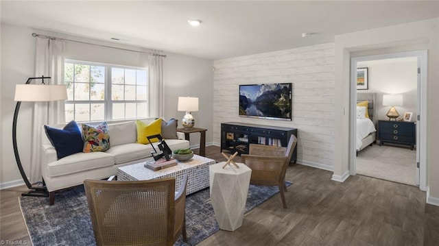 living room with dark hardwood / wood-style flooring