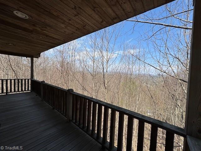 197 Mahogany Ct, Lansing, NC 28643 - wooden terrace with a view of trees