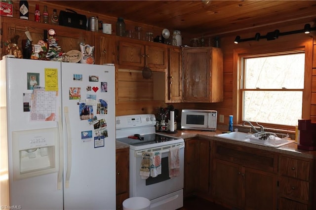 197 Mahogany Ct, Lansing, NC 28643 - kitchen with brown cabinets, wooden ceiling, a sink, and white appliances