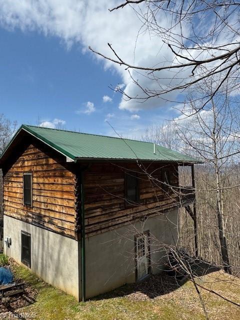 197 Mahogany Ct, Lansing, NC 28643 - view of property exterior with metal roof