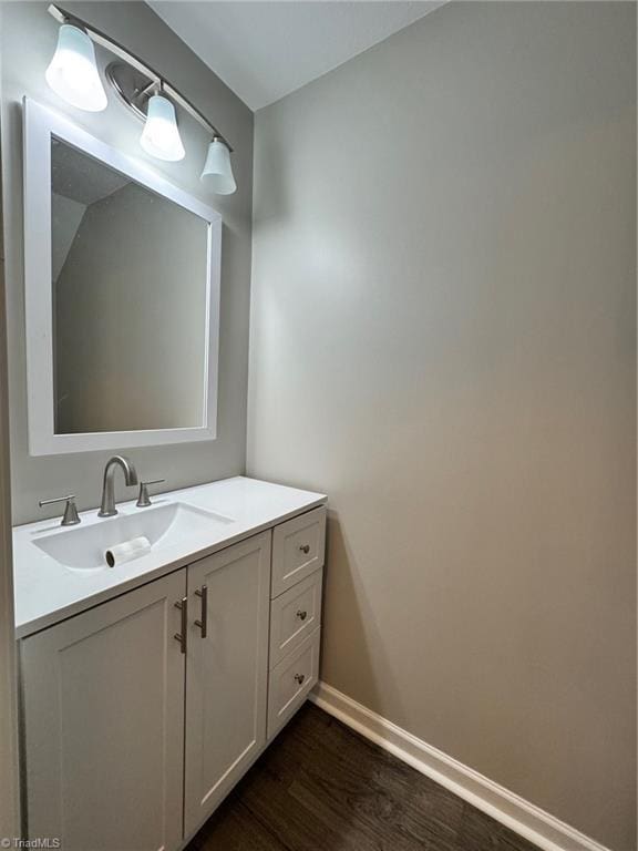 bathroom with vanity and wood-type flooring