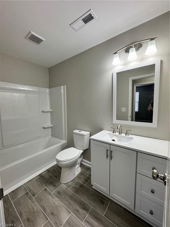 full bathroom with shower / bathing tub combination, vanity, and toilet