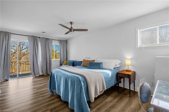 bedroom featuring ceiling fan, wood finished floors, and access to exterior