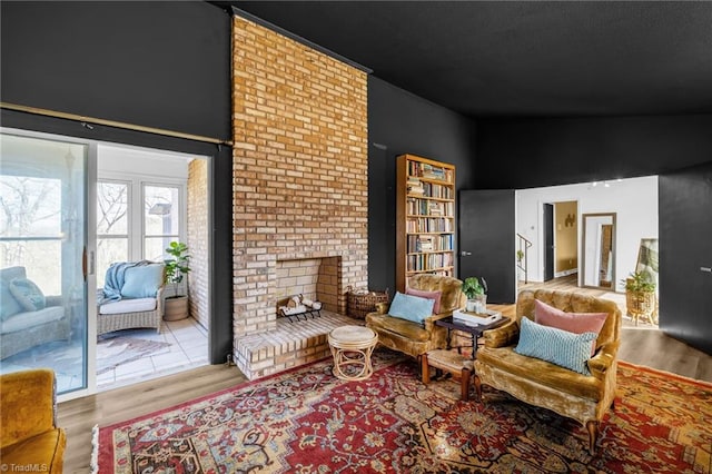 sitting room featuring wood finished floors and a fireplace