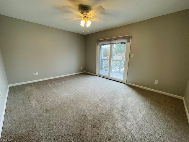 unfurnished room featuring ceiling fan and carpet flooring