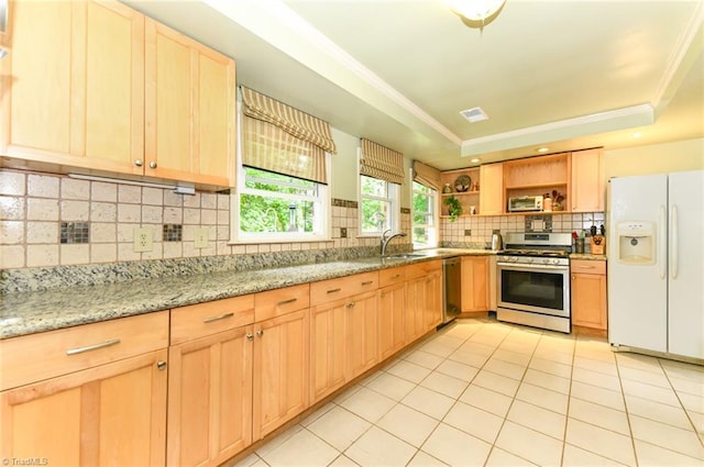 kitchen with open shelves, a sink, light brown cabinetry, stainless steel appliances, and a raised ceiling