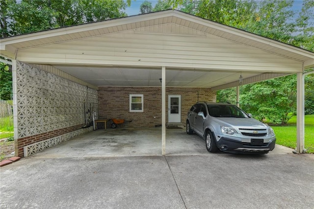 view of parking / parking lot featuring an attached carport and driveway