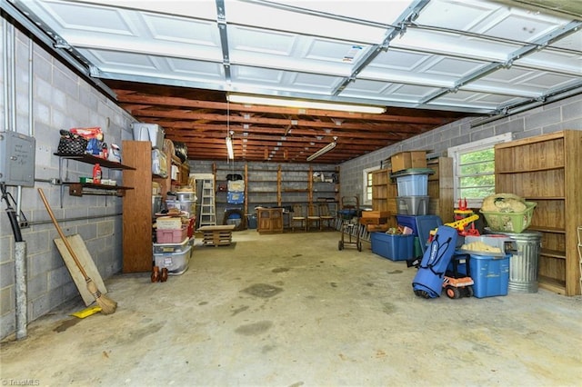 garage with concrete block wall