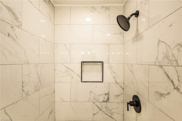 bathroom featuring tiled shower