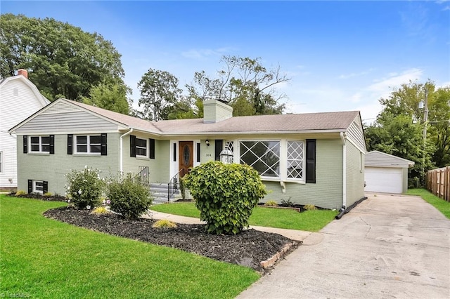 ranch-style house with a front yard, an outbuilding, and a garage