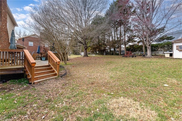 view of yard with fence and a wooden deck