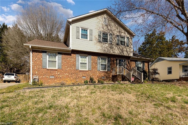 view of front of house with a front yard, crawl space, brick siding, and roof with shingles