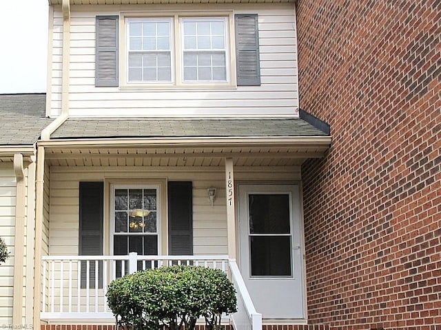 property entrance featuring covered porch