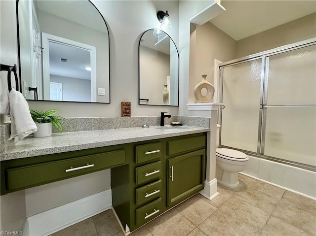 bathroom featuring visible vents, bath / shower combo with glass door, toilet, tile patterned floors, and vanity