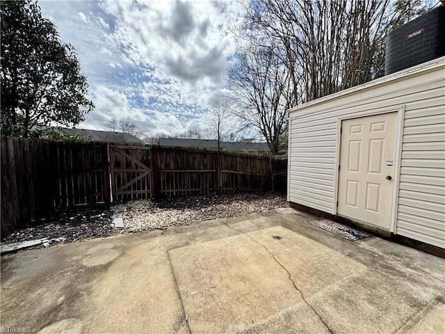 view of patio with a gate and fence