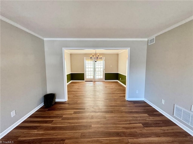 empty room with visible vents, baseboards, dark wood-type flooring, and french doors