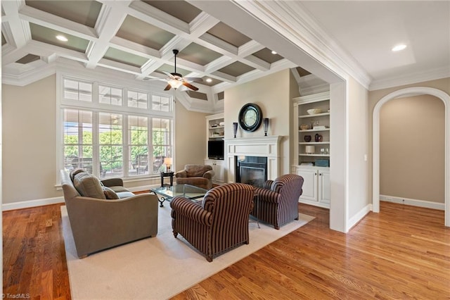 5459 Brookberry Farm Rd, Winston-Salem, NC 27106 - living room featuring a glass covered fireplace, a ceiling fan, ornamental molding, baseboards, and wood finished floors