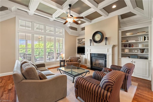 5459 Brookberry Farm Rd, Winston-Salem, NC 27106 - living room with wood finished floors, a glass covered fireplace, a ceiling fan, coffered ceiling, and baseboards