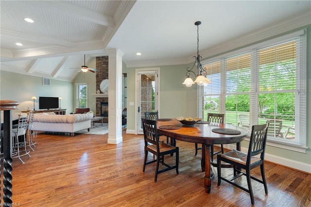 5459 Brookberry Farm Rd, Winston-Salem, NC 27106 - dining area featuring light wood finished floors, a fireplace, baseboards, a ceiling fan, and crown molding