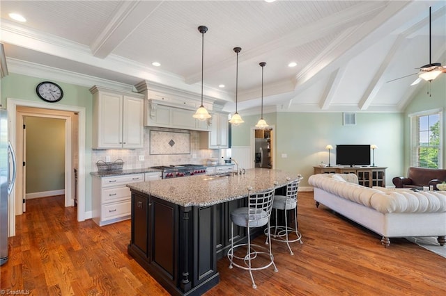 5459 Brookberry Farm Rd, Winston-Salem, NC 27106 - kitchen with open floor plan, a sink, beam ceiling, dark wood-type flooring, and light stone counters