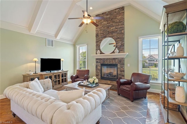 5459 Brookberry Farm Rd, Winston-Salem, NC 27106 - living area with baseboards, a ceiling fan, wood finished floors, beam ceiling, and a stone fireplace