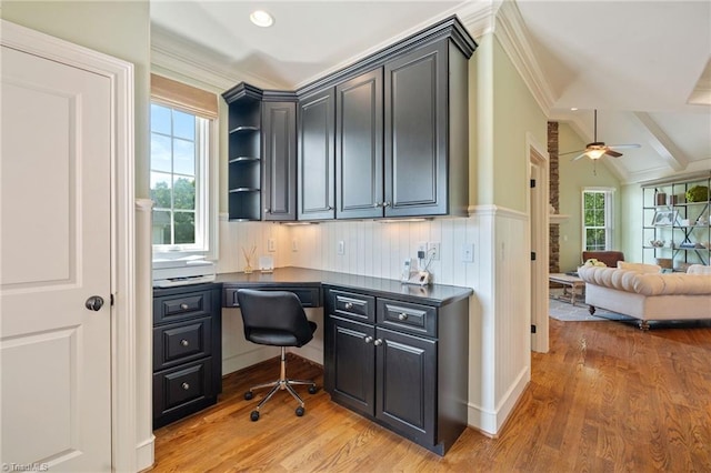 5459 Brookberry Farm Rd, Winston-Salem, NC 27106 - office featuring built in desk, light wood-style floors, ceiling fan, ornamental molding, and wainscoting