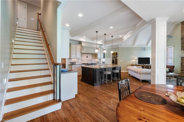 5459 Brookberry Farm Rd, Winston-Salem, NC 27106 - dining space with dark wood finished floors, ornate columns, recessed lighting, ornamental molding, and stairs