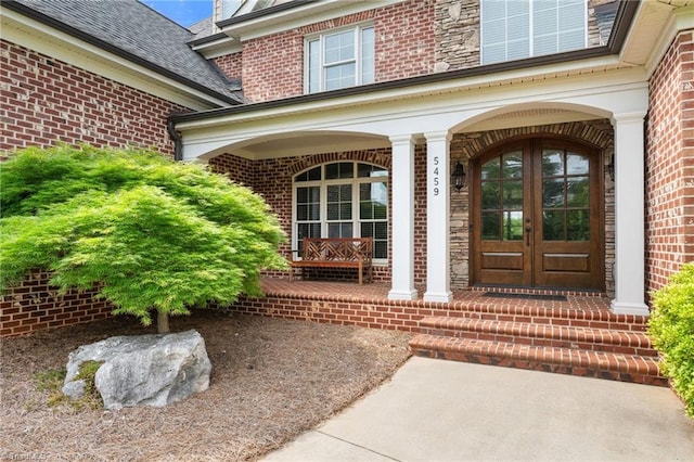 5459 Brookberry Farm Rd, Winston-Salem, NC 27106 - property entrance featuring covered porch, brick siding, and french doors