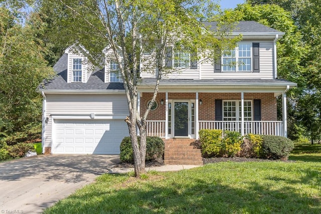 7905 Cress Ct, Oak Ridge, NC 27310 - view of front of property featuring brick siding, a porch, driveway, and an attached garage