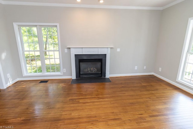 7905 Cress Ct, Oak Ridge, NC 27310 - unfurnished living room with hardwood / wood-style floors, ornamental molding, a fireplace with flush hearth, and baseboards