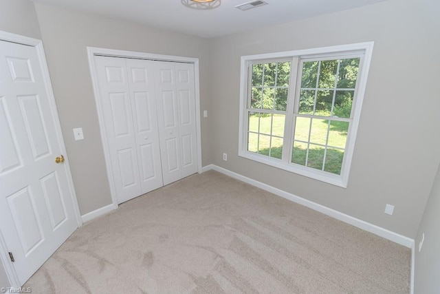 7905 Cress Ct, Oak Ridge, NC 27310 - unfurnished bedroom with carpet flooring, baseboards, and a closet