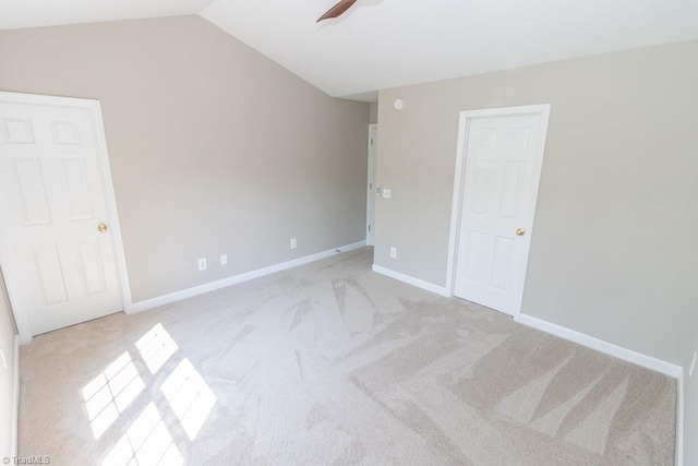 7905 Cress Ct, Oak Ridge, NC 27310 - unfurnished bedroom with light colored carpet, lofted ceiling, baseboards, and ceiling fan