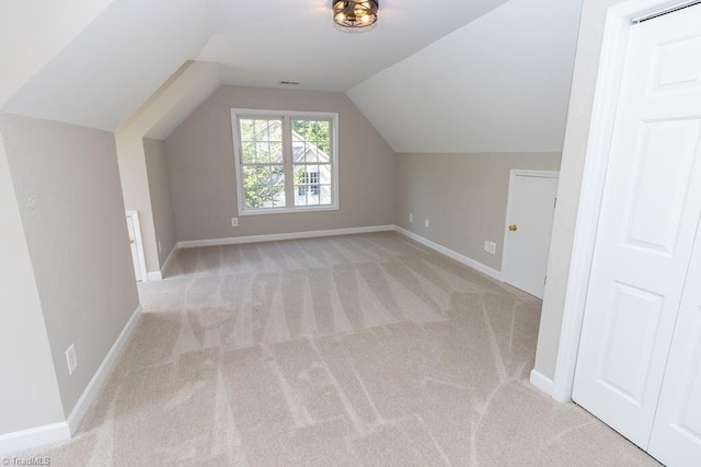 7905 Cress Ct, Oak Ridge, NC 27310 - bonus room with light colored carpet, vaulted ceiling, and baseboards