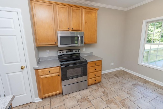 7905 Cress Ct, Oak Ridge, NC 27310 - kitchen with stainless steel appliances, stone finish flooring, light countertops, baseboards, and ornamental molding