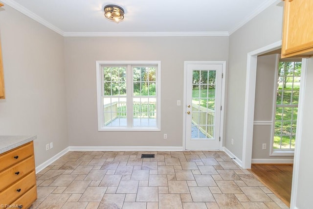 7905 Cress Ct, Oak Ridge, NC 27310 - doorway to outside featuring stone finish flooring, crown molding, and baseboards