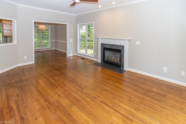 7905 Cress Ct, Oak Ridge, NC 27310 - unfurnished living room featuring ceiling fan, wood finished floors, ornamental molding, and baseboards