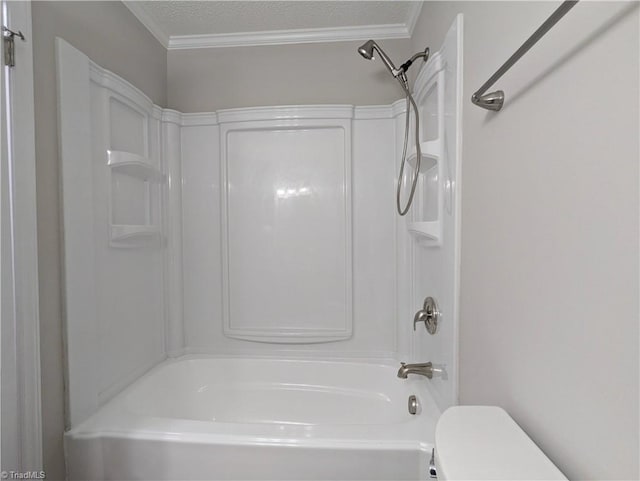 bathroom with crown molding, toilet, a textured ceiling, and washtub / shower combination