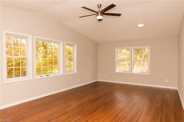 spare room with ceiling fan, lofted ceiling, dark wood finished floors, baseboards, and recessed lighting