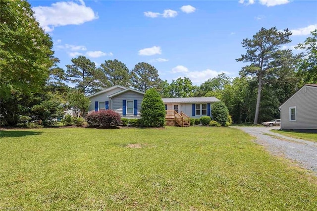 207 Bingham St, Carthage, NC 28327 - view of front of home with a front yard and driveway