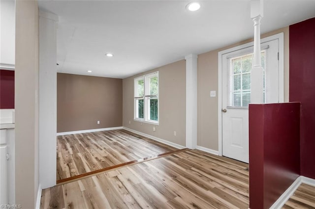 207 Bingham St, Carthage, NC 28327 - entrance foyer with wood finished floors, baseboards, recessed lighting, and decorative columns