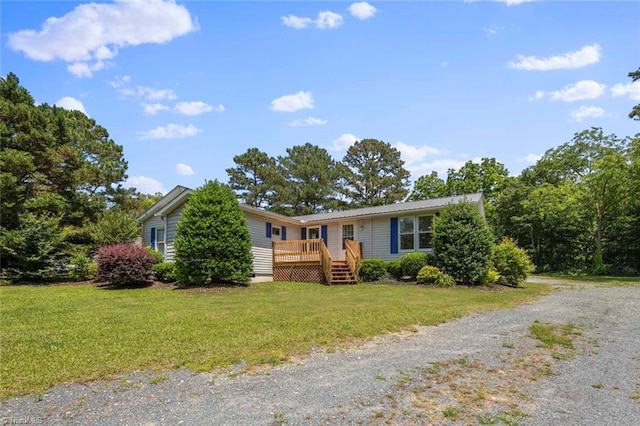 207 Bingham St, Carthage, NC 28327 - ranch-style home featuring a wooden deck, a front yard, and driveway