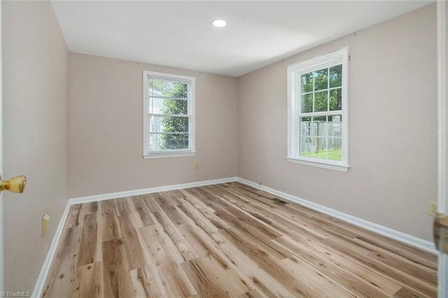 207 Bingham St, Carthage, NC 28327 - spare room with healthy amount of natural light, baseboards, light wood-type flooring, and recessed lighting