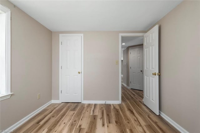 207 Bingham St, Carthage, NC 28327 - unfurnished bedroom with light wood finished floors and baseboards