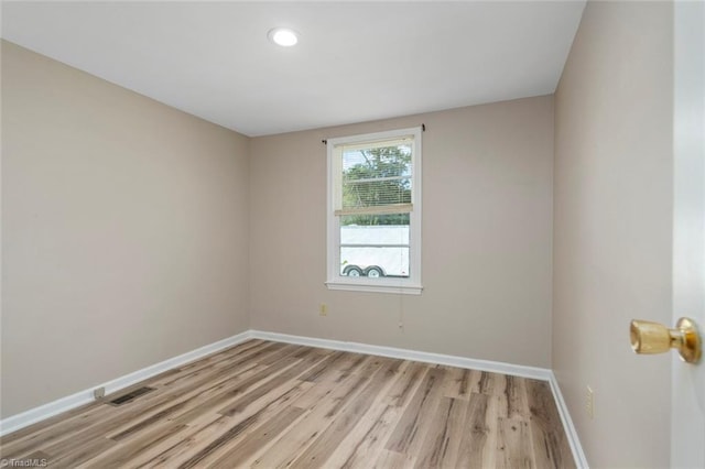 207 Bingham St, Carthage, NC 28327 - unfurnished room featuring baseboards, light wood-type flooring, and recessed lighting