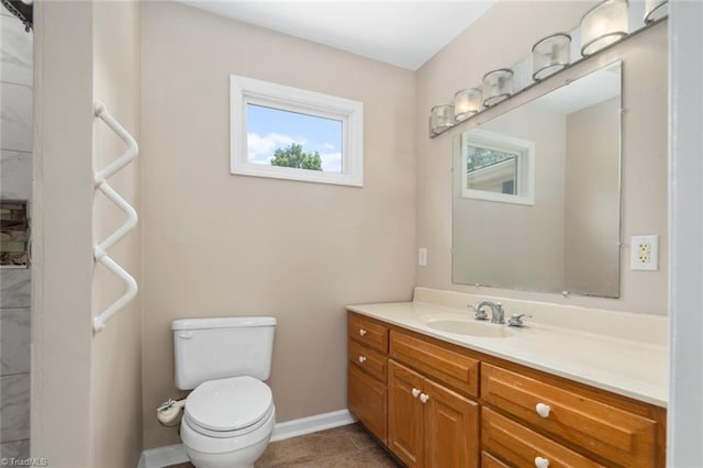 207 Bingham St, Carthage, NC 28327 - bathroom featuring vanity, toilet, tile patterned flooring, and baseboards